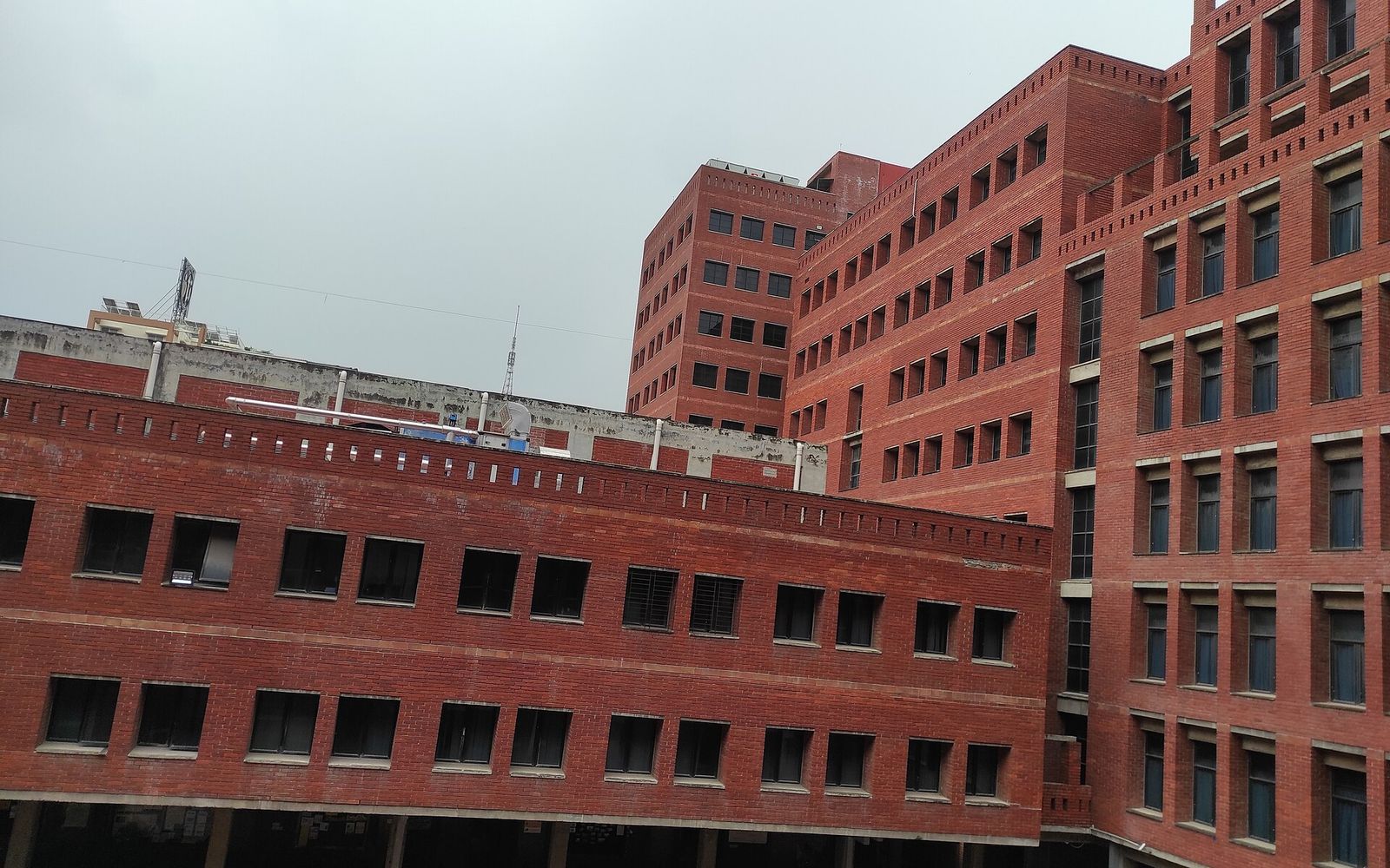 bKash bnext Internship: What bKash Has Published, What It Hasn't, and How to Be Ready for the Next Window 2 The CV Guy is the No.1 Resume/CV Writer in Bangladesh, Asia & Middle East Red brick academic buildings around a courtyard at East West University, Aftabnagar, Dhaka
