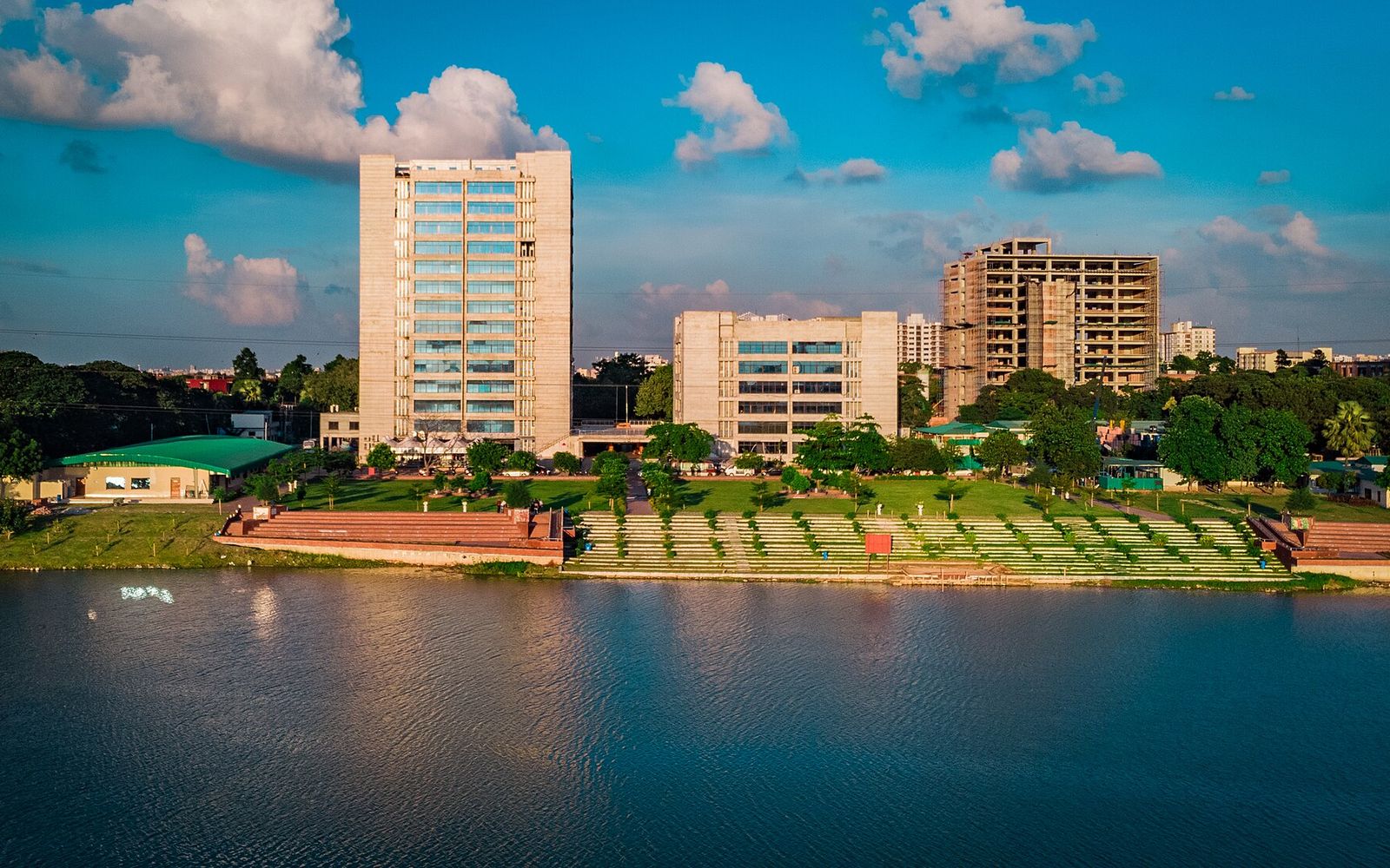 BAT Global Graduate Programme in Bangladesh: What Is Published and What Is Not 2 The CV Guy is the No.1 Resume/CV Writer in Bangladesh, Asia & Middle East Aerial view of the Bangladesh University of Professionals campus in Dhaka, with academic towers behind a lake and stepped green bank
