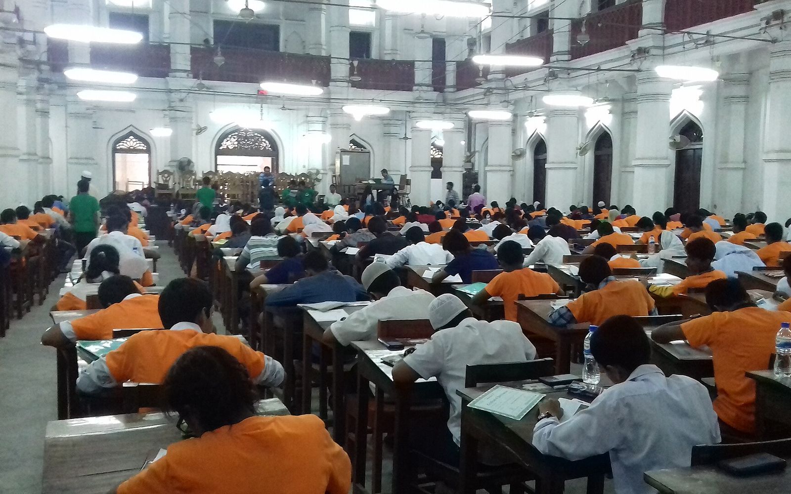 Bank MTO Written Exam Preparation: What the 2026 Papers Actually Test 1 The CV Guy is the No.1 Resume/CV Writer in Bangladesh, Asia & Middle East Rows of candidates writing at wooden desks inside Curzon Hall, University of Dhaka, during a national exam round