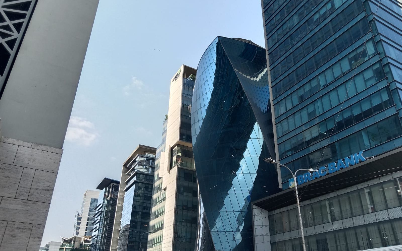 What a Fresher CV for an MNC Application Should Contain: The Record in Bangladesh 2 The CV Guy is the No.1 Resume/CV Writer in Bangladesh, Asia & Middle East Glass office towers along Kemal Ataturk Avenue in Banani, Dhaka, seen from street level against a clear sky