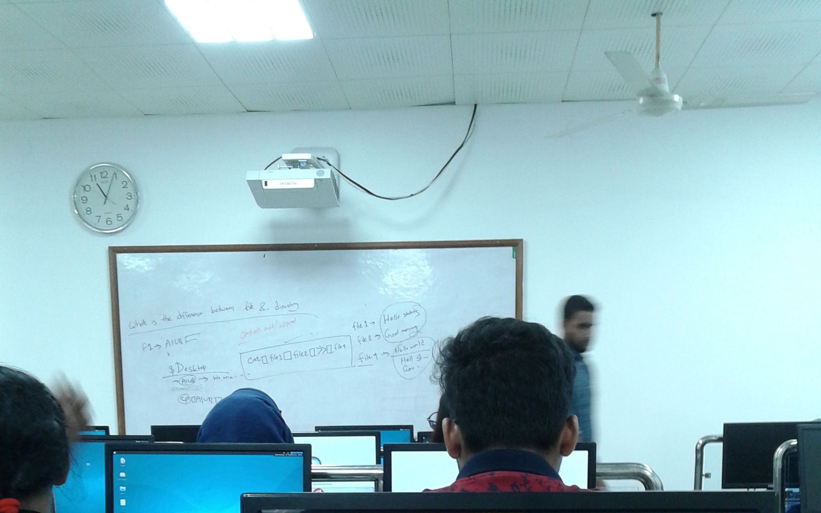 MNC Aptitude and Assessment Tests in Bangladesh: What Each Employer Has Put on Record 1 The CV Guy is the No.1 Resume/CV Writer in Bangladesh, Asia & Middle East Students seen from behind at desktop computers in a university computer lab in Dhaka, facing a whiteboard and a wall clock
